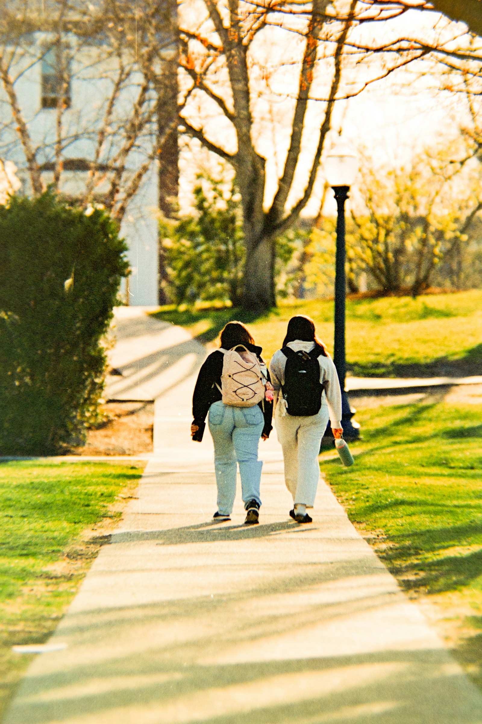 A parent and child walking together outdoors